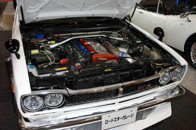 White Nissan Skyline Sedan open hood